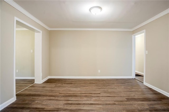 unfurnished room with ornamental molding and dark hardwood / wood-style floors