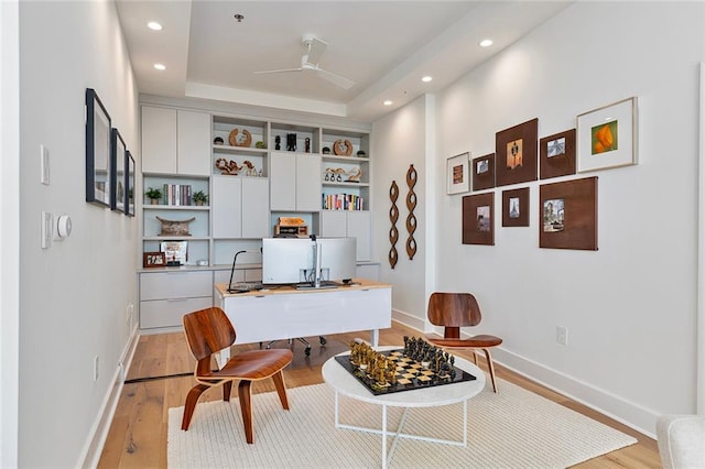 office featuring light wood-style flooring, recessed lighting, a ceiling fan, and baseboards