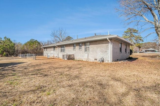 back of house with a yard