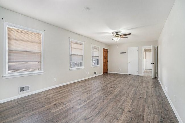 unfurnished room featuring ceiling fan and wood-type flooring