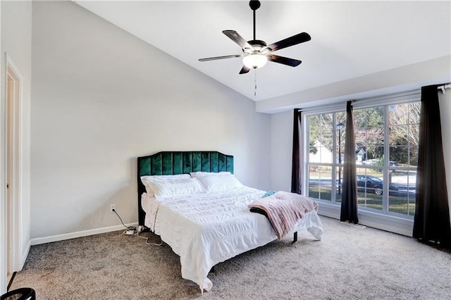 bedroom with light carpet, baseboards, lofted ceiling, and a ceiling fan
