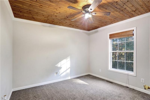 unfurnished room featuring carpet flooring, baseboards, ornamental molding, a ceiling fan, and wooden ceiling