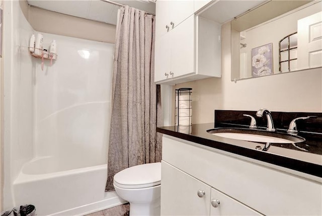full bath featuring toilet, shower / bath combination with curtain, and vanity