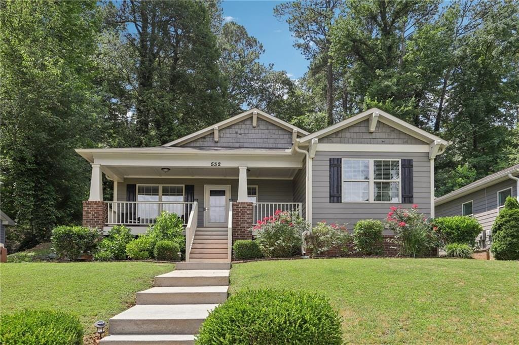 532 Lemon St NE, Marietta, GA 30060 - view of front facade featuring a front yard, a porch, and stairs