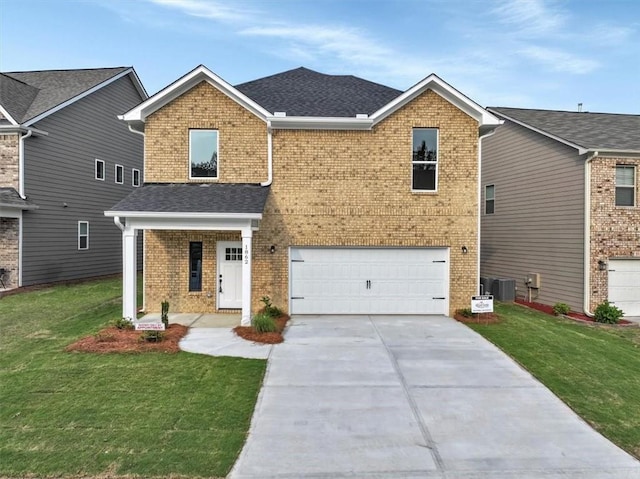 view of front facade featuring a garage, central AC, and a front lawn