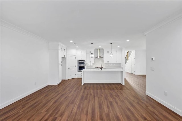 unfurnished living room featuring dark hardwood / wood-style flooring and crown molding