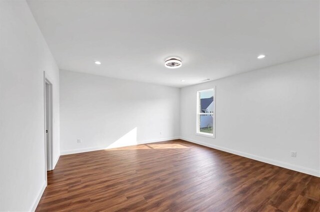 unfurnished room featuring dark hardwood / wood-style floors