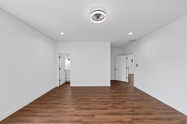 empty room with dark hardwood / wood-style floors