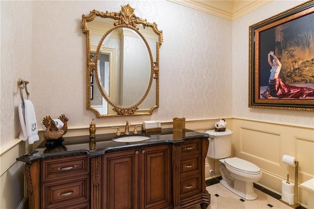 bathroom featuring vanity, tile patterned floors, and toilet