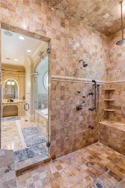 bathroom featuring vanity and a shower with shower door