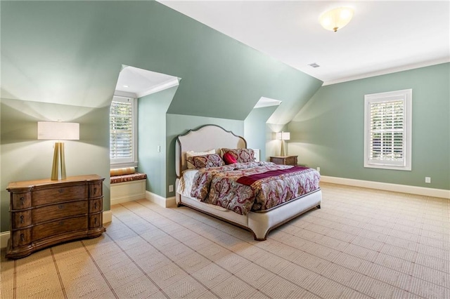 carpeted bedroom with vaulted ceiling