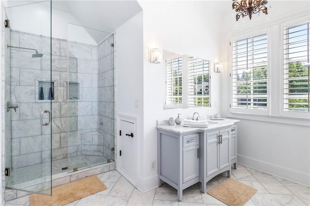 bathroom featuring lofted ceiling, vanity, and a shower with door