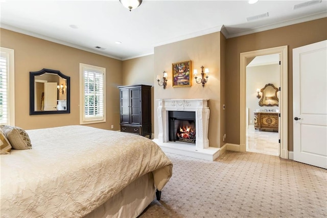 carpeted bedroom with ornamental molding and a high end fireplace