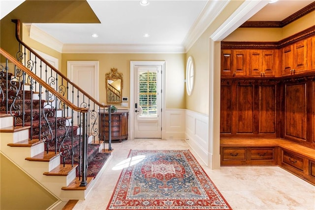 entrance foyer featuring crown molding