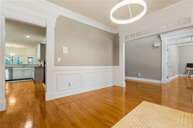 1360 Mount Mickinley Dr, Grayson, GA 30017 - unfurnished dining area featuring wood finished floors, ornamental molding, and wainscoting