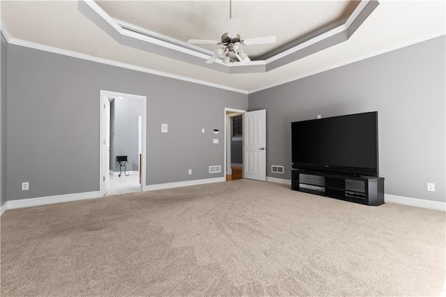 1360 Mount Mickinley Dr, Grayson, GA 30017 - unfurnished living room featuring a raised ceiling, ornamental molding, carpet, and a ceiling fan