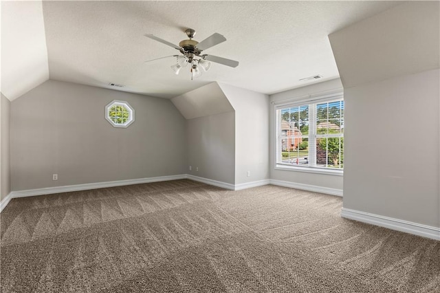 1360 Mount Mickinley Dr, Grayson, GA 30017 - additional living space featuring carpet, lofted ceiling, a ceiling fan, and a textured ceiling