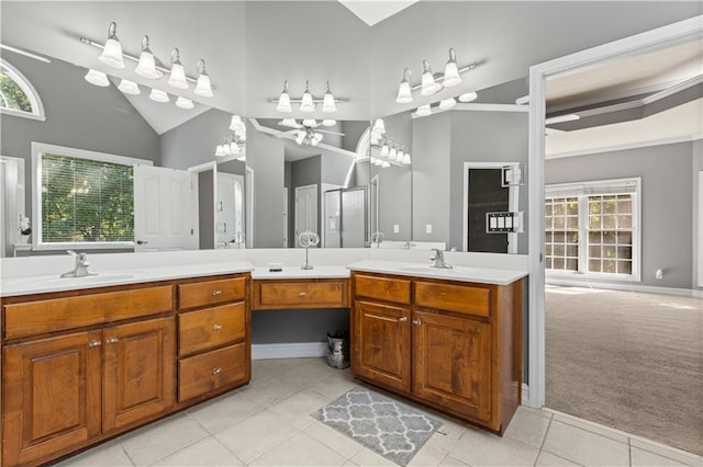 1360 Mount Mickinley Dr, Grayson, GA 30017 - bathroom with double vanity, tile patterned floors, a ceiling fan, and vaulted ceiling
