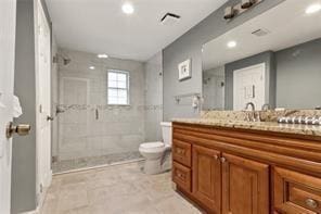 1360 Mount Mickinley Dr, Grayson, GA 30017 - bathroom featuring vanity, tiled shower, and recessed lighting