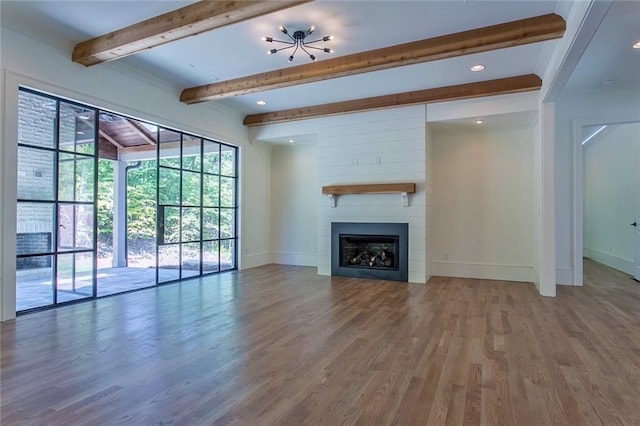 unfurnished living room featuring recessed lighting, a large fireplace, wood finished floors, baseboards, and beamed ceiling