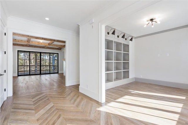 unfurnished room featuring beam ceiling, coffered ceiling, crown molding, and baseboards