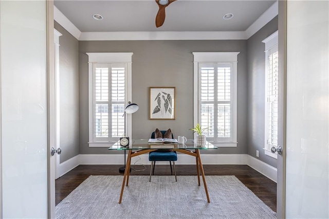 office space with baseboards and wood finished floors