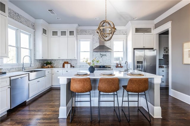 kitchen featuring a sink, visible vents, appliances with stainless steel finishes, and light countertops