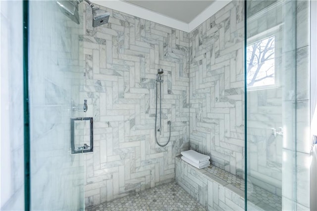 bathroom with tiled shower