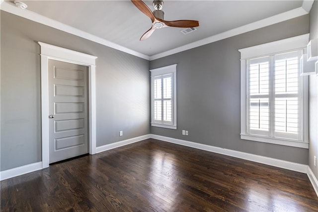 unfurnished room with wood finished floors, visible vents, baseboards, ceiling fan, and crown molding