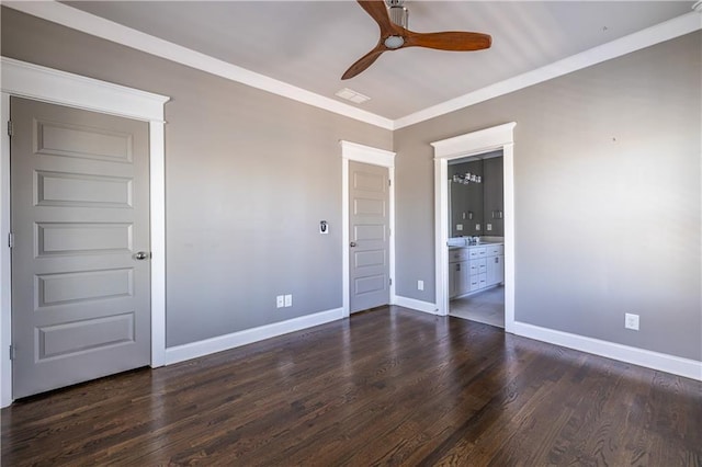 unfurnished bedroom featuring visible vents, ornamental molding, ensuite bathroom, baseboards, and dark wood-style flooring