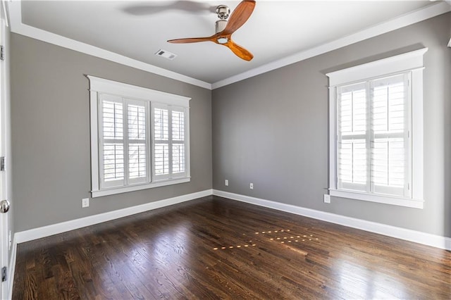 unfurnished room featuring baseboards, dark wood-type flooring, ornamental molding, and a ceiling fan