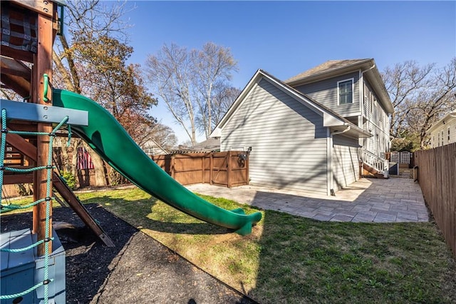 view of jungle gym with a patio and a fenced backyard