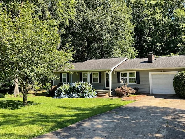 ranch-style home featuring a garage and a front yard