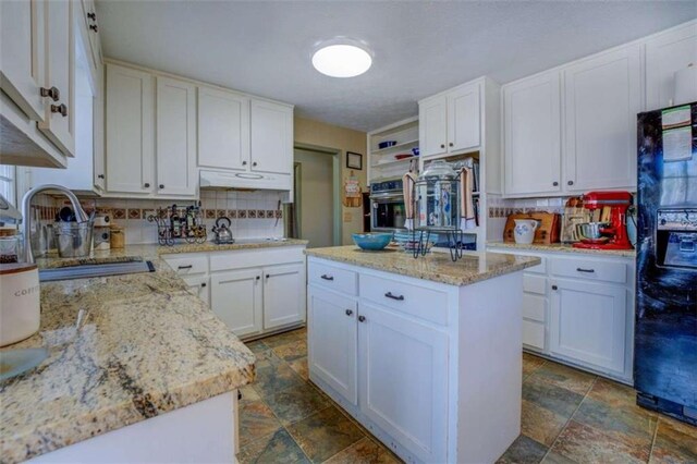 laundry room with stacked washer and clothes dryer