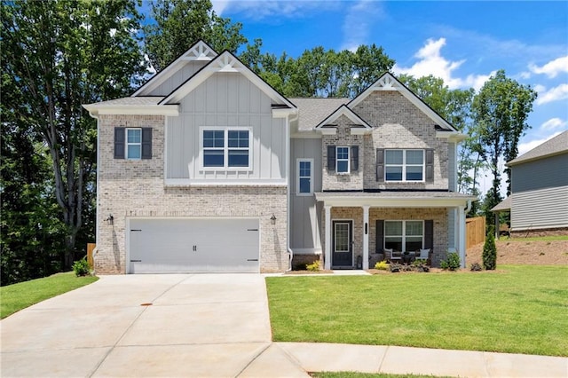 craftsman-style house featuring a garage, a front yard, and a porch