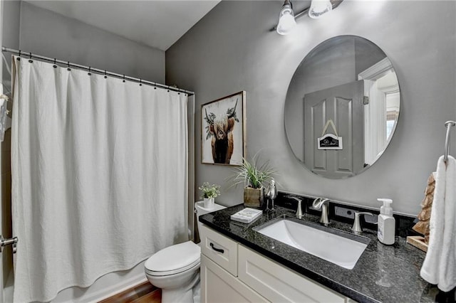 full bathroom featuring vanity, toilet, and shower / bath combo with shower curtain