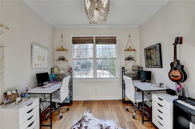 office space with crown molding, light hardwood / wood-style flooring, and a healthy amount of sunlight