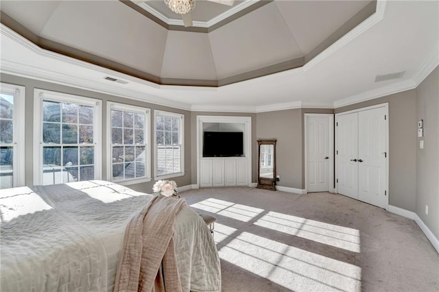 carpeted bedroom featuring a raised ceiling, ornamental molding, and multiple windows