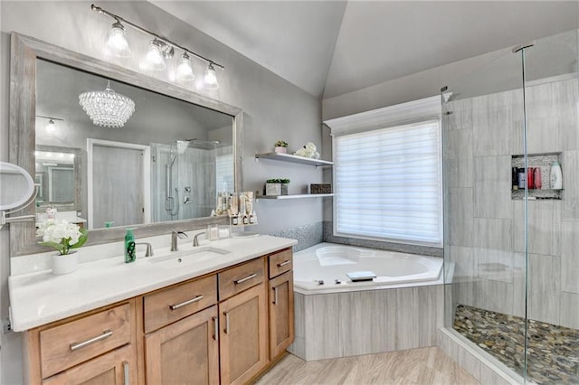 bathroom featuring vanity, plus walk in shower, and vaulted ceiling