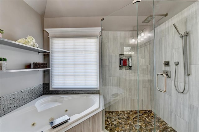 bathroom with vaulted ceiling and independent shower and bath