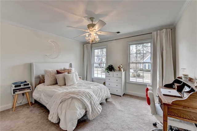 carpeted bedroom with crown molding and ceiling fan