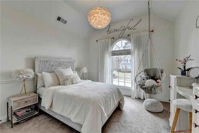 bedroom featuring lofted ceiling and carpet flooring