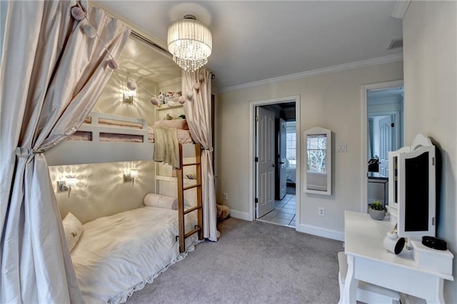 carpeted bedroom with an inviting chandelier, crown molding, and ensuite bath