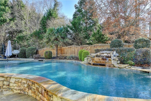 view of pool with pool water feature