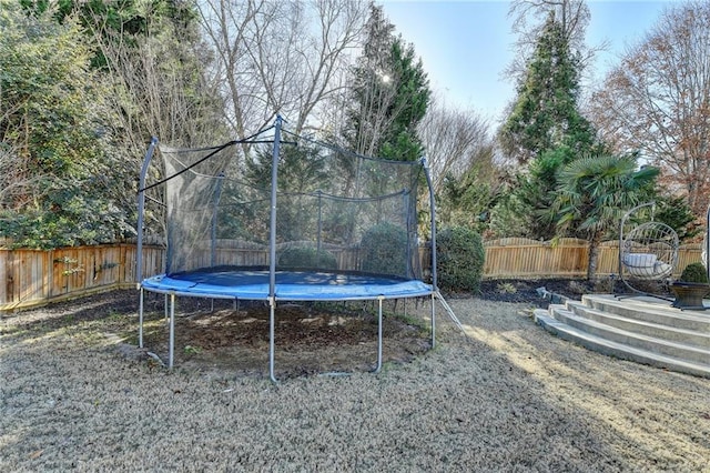 view of yard with a trampoline