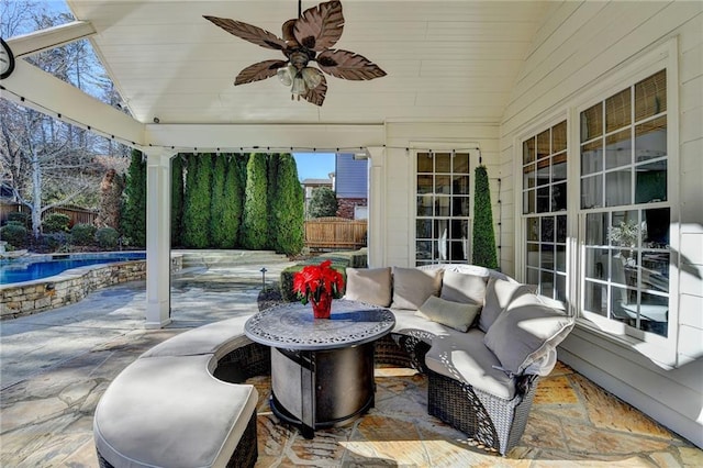 view of patio featuring ceiling fan