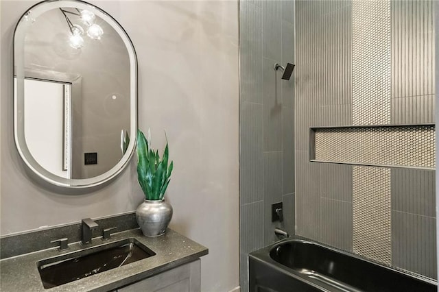 bathroom with vanity and shower / bathing tub combination