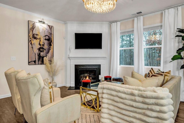 living room with crown molding, an inviting chandelier, and dark hardwood / wood-style floors