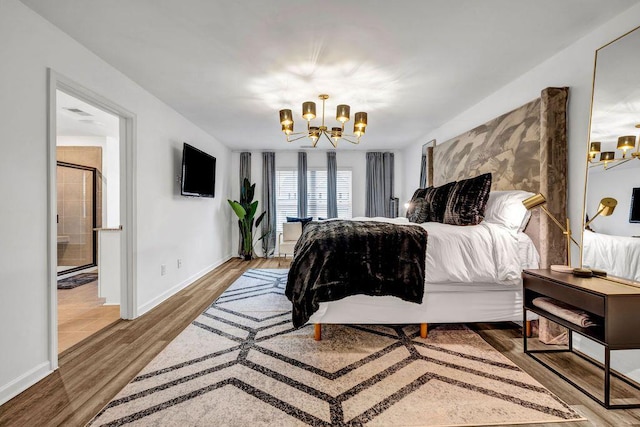 bedroom featuring a chandelier and wood-type flooring