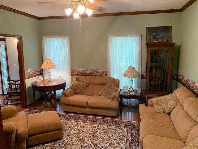 living room featuring crown molding, ceiling fan, and hardwood / wood-style flooring